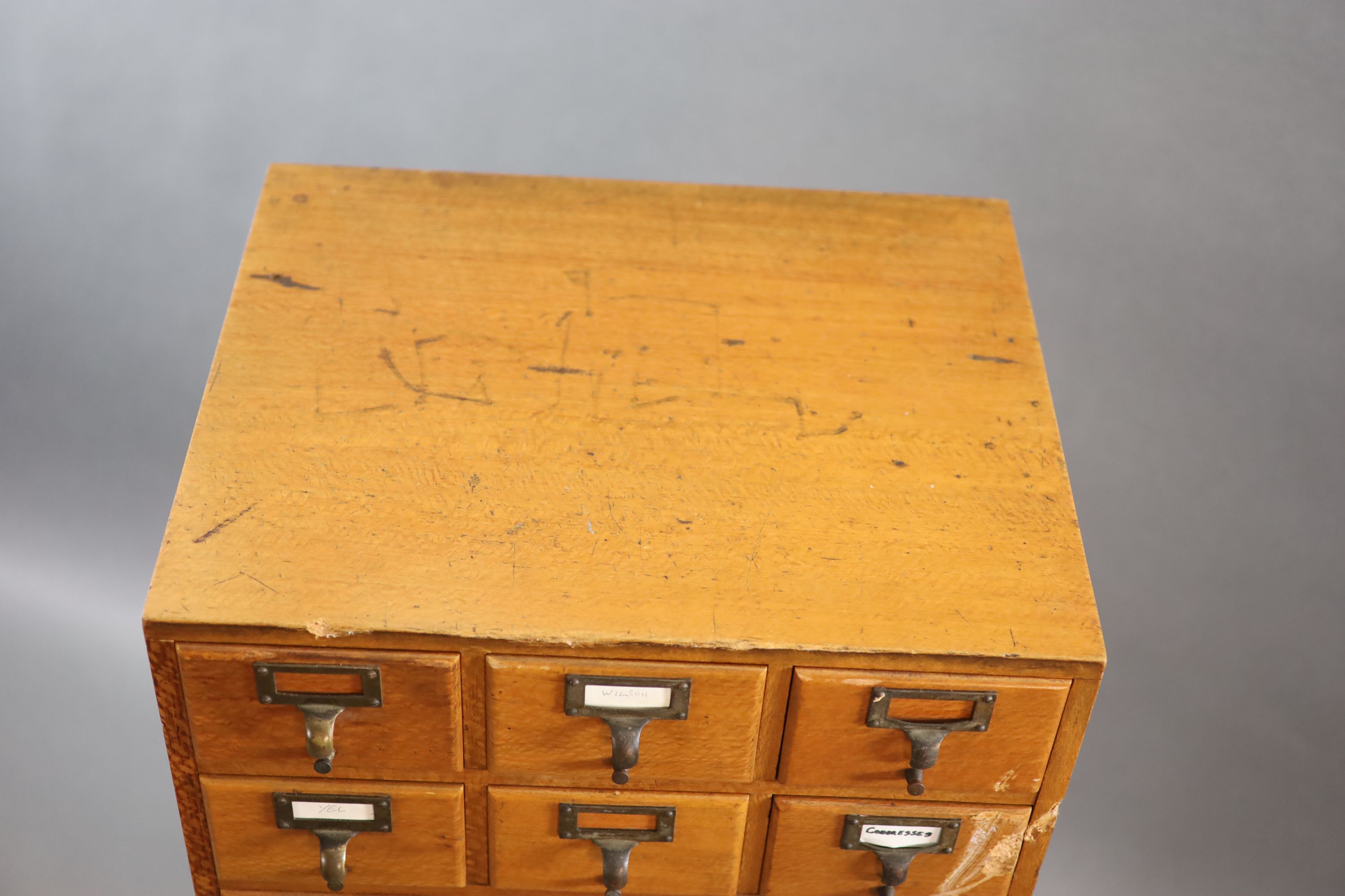 An early 20th century golden oak filing chest on stand, fitted twelve drawers, width 50cm depth 41cm height 131cm